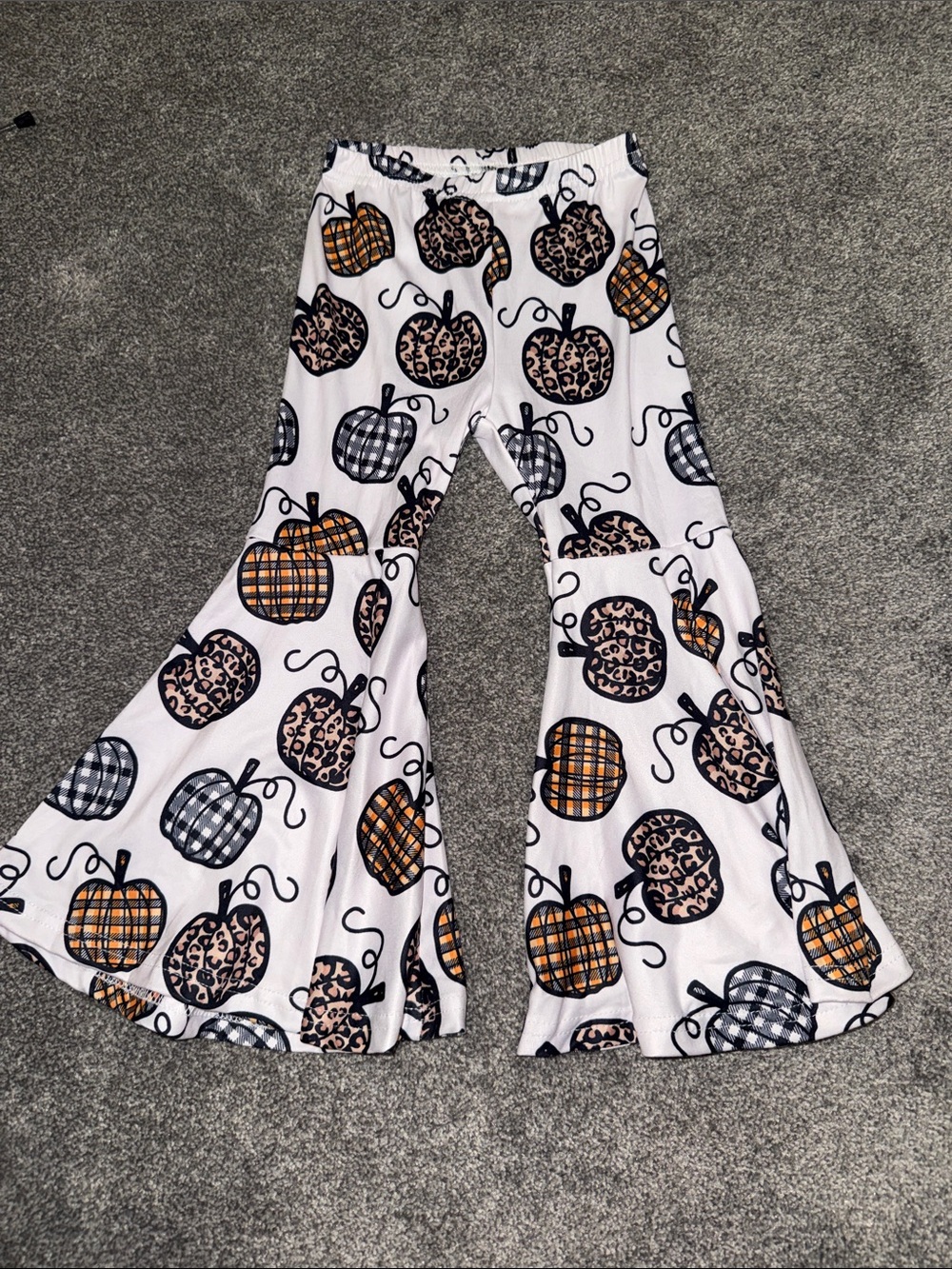 Girls White Flared Pants with Orange & Black Pumpkin Print